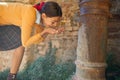 Young girl drinks from a drinking fountain Royalty Free Stock Photo