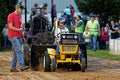 A Young Girl Drives at a Lawn Tractor Pull