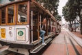 Young girl driving on the cable car in San Francisco Royalty Free Stock Photo