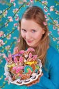 Young girl with easter gingerbread cookies