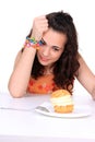 Young girl eating cake