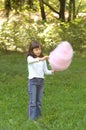 Young girl eating cotton candy Royalty Free Stock Photo