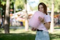 Young girl eating cotton candy in the park Royalty Free Stock Photo