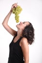 Young girl eating grapes