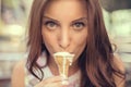 Young girl eating ice cream in the city street Royalty Free Stock Photo