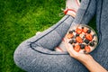 Young girl eating a oatmeal with berries after a workout . Royalty Free Stock Photo