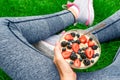 Young girl eating a oatmeal with berries after a workout . Royalty Free Stock Photo