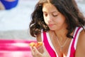 Young Girl Eating a Peach