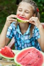 Young girl eating ripe watermelon Royalty Free Stock Photo