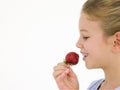 Young girl eating strawberry Royalty Free Stock Photo