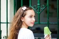 Girl eating a traditional water ice cream typical of the Valle del Cauca region in Colombia Royalty Free Stock Photo