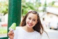 Girl eating a traditional water ice cream typical of the Valle del Cauca region in Colombia Royalty Free Stock Photo