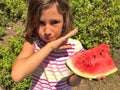 Young girl eating watermelon outdoors Royalty Free Stock Photo