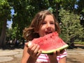 Young girl eating watermelon outdoors Royalty Free Stock Photo