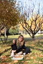 Young girl eats pizza in the park Royalty Free Stock Photo