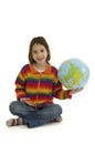 Young girl embracing the world globe Royalty Free Stock Photo