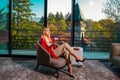 Young girl enjoying her morning. Perfect woman legs in the living room at home. Beautiful girl in hotel rooms. Royalty Free Stock Photo