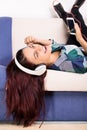 Young girl relaxing while listening to music Royalty Free Stock Photo