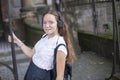 Young girl enjoying music in headphones on the street. Happy. Royalty Free Stock Photo