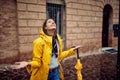 A young girl is enjoying rain drops falling on her. Walk, rain, city Royalty Free Stock Photo