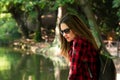 The young girl enjoying the sun and nature in the park, at the b Royalty Free Stock Photo