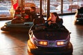 A young girl enjoys a turn on the bumper cars Royalty Free Stock Photo