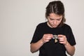 Young girl examinating a damaged electric socket