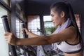 Young girl exercise bike cardio workout at fitness gym Royalty Free Stock Photo