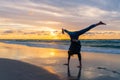 Young girl exercising on a seaside beach at sunset Royalty Free Stock Photo