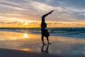 Young girl exercising on a seaside beach at sunset Royalty Free Stock Photo