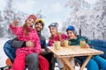 Young girl with family enjoying in winter vacation on snow and m Royalty Free Stock Photo