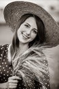 Farm girl holding wheat ears on a field Royalty Free Stock Photo