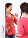 Girl happy to lose weight Royalty Free Stock Photo