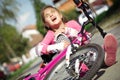 Young girl fell from the bike in a park Royalty Free Stock Photo