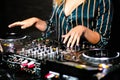 Young girl female shot party dj audio controlling mixing. Turntable High quality Sound mixing controller disc jockey hands of woma Royalty Free Stock Photo