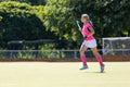 Young girl field hockey player running on pitch Royalty Free Stock Photo