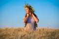 Young girl at field with ripe wheat Royalty Free Stock Photo