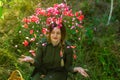 Young girl with flowers in the garden Royalty Free Stock Photo