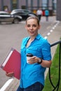 Girl with folders for papers and coffee