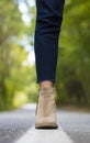 Close up of a foot and elegant boot - forest background