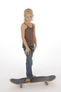 Young girl with foot on skateboard