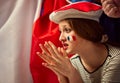 Young girl, football fan emotionally watching live championship. Favorite sport team of france. Losing game Royalty Free Stock Photo