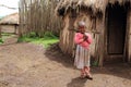 young girl at the front of her hut in a Masai village Royalty Free Stock Photo