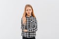 Young girl frowns and looks very dissatisfied, shake forefinger telling no way, scolding or telling off someone, dont give