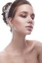 A young girl in a gentle wedding image with a diadem on her head. Beautiful model in the image of the bride on a white isolated ba Royalty Free Stock Photo