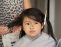 Young girl getting a haircut