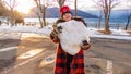 Young girl with giant snowball Royalty Free Stock Photo