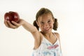 Young girl giving an apple Royalty Free Stock Photo