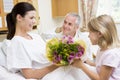 Young Girl Giving Flowers To Mother In Hospital Royalty Free Stock Photo