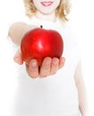 Young girl giving red apple Royalty Free Stock Photo